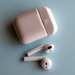 Wireless earbuds with a recharge container