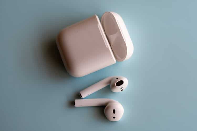 Wireless earbuds with a recharge container