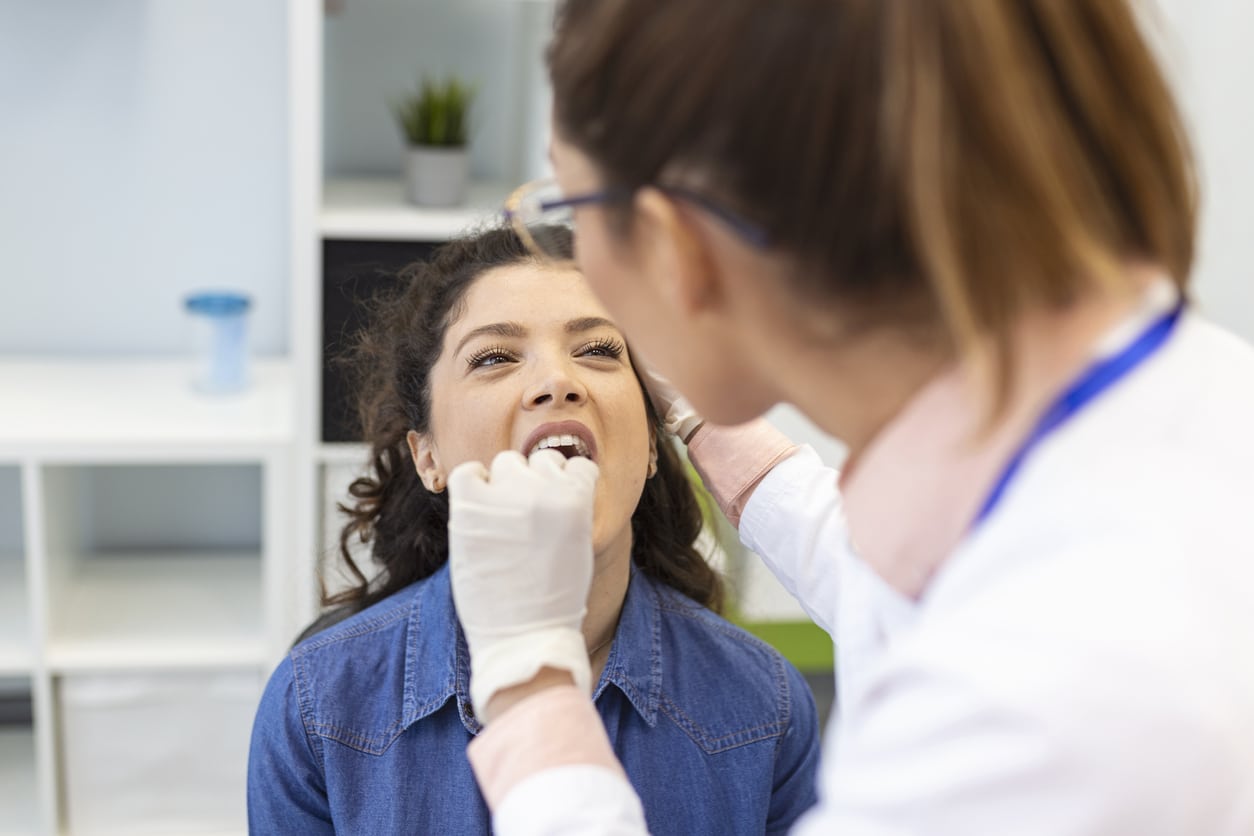 Woman having her tonsils looked at